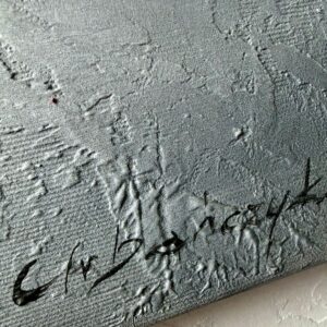 obraz kolorowe miasto w ramie podpis autora